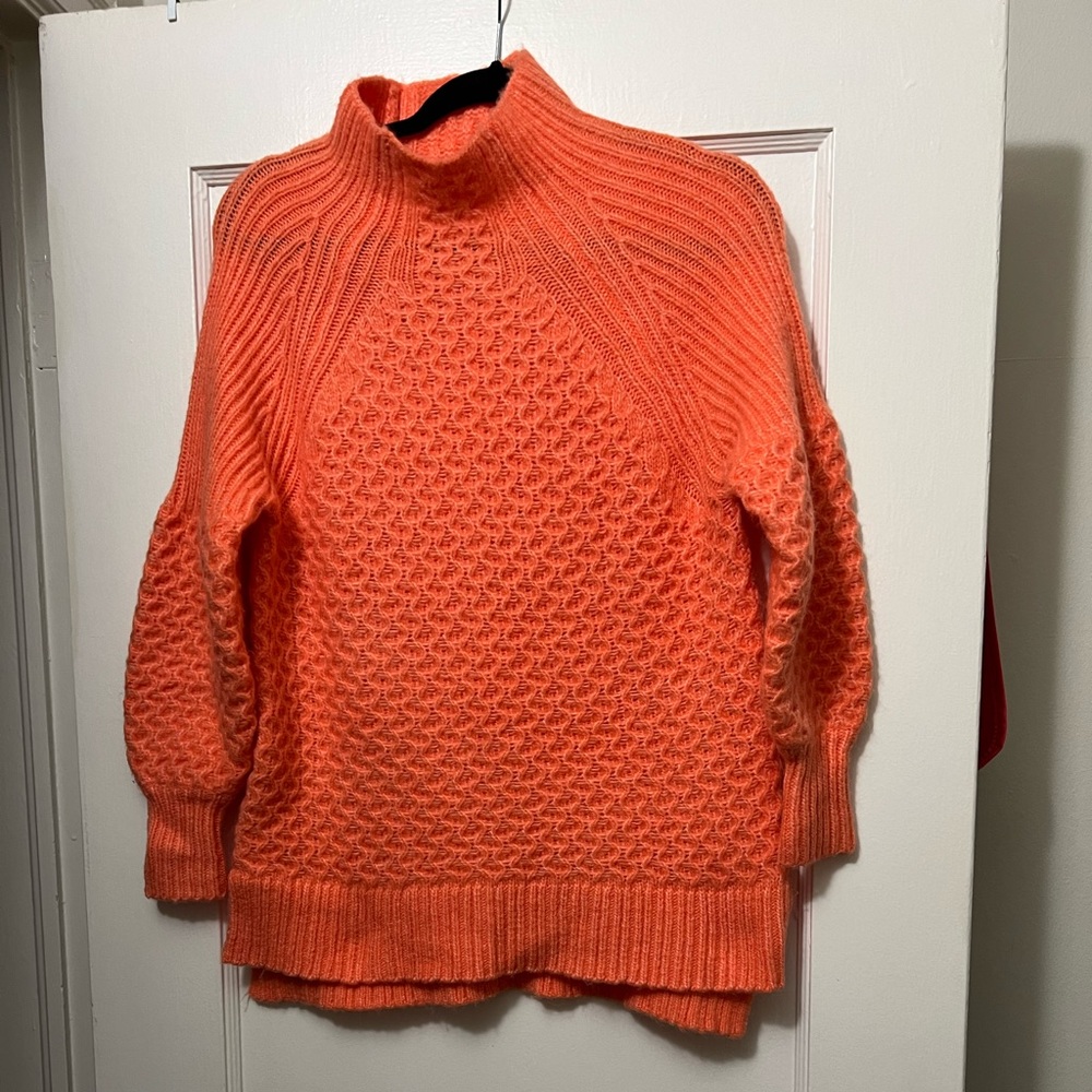 Anthropologie tangerine colored sweater